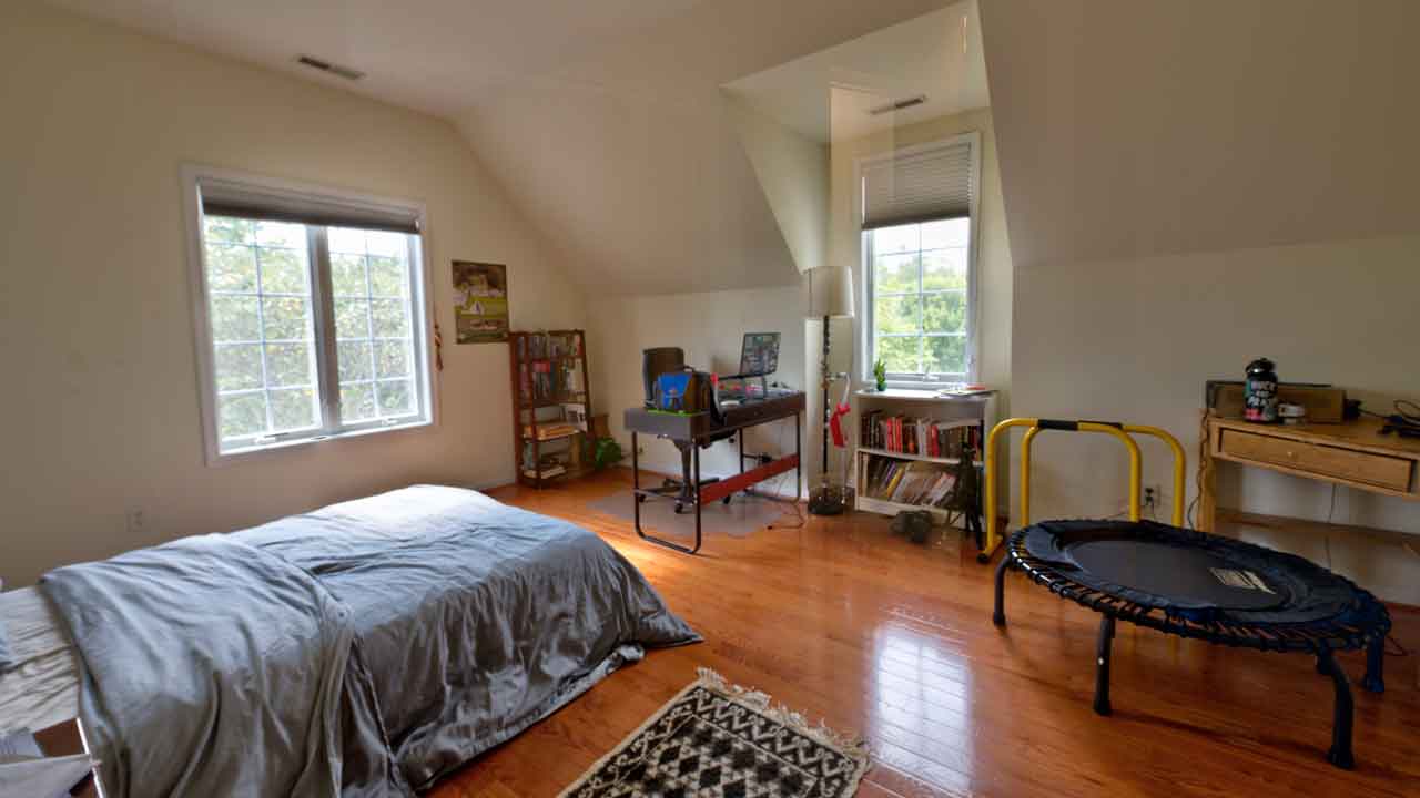 Upstairs bedroom at Cheval Noir with cozy design and plenty of natural light