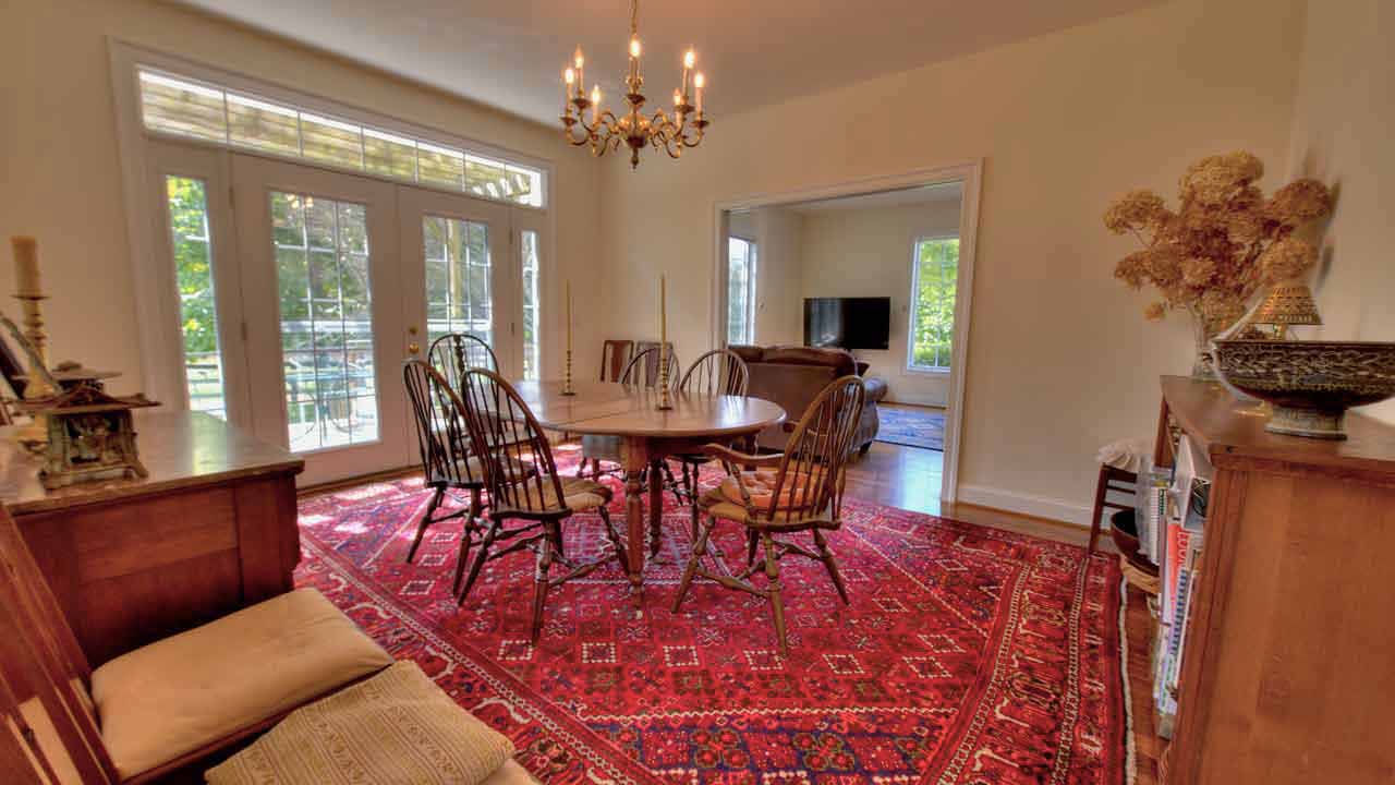 Cheval Noir dining room featuring large windows with abundant natural light