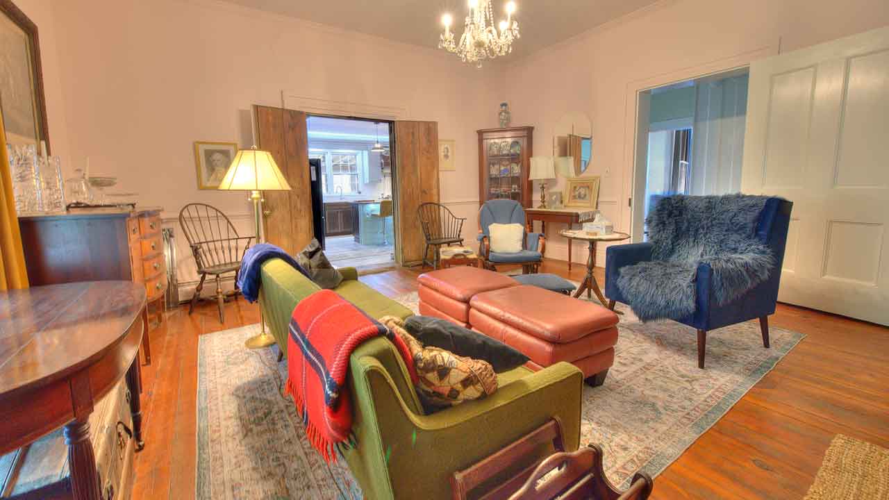 Mickle Knox - Formal dining room with fireplace and large windows