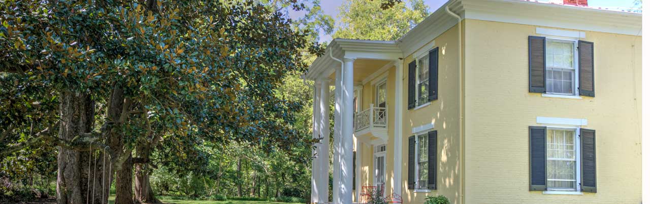 c.1845 Mickle Knox estate with brick exterior and two-story columned porch